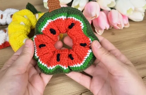 Crochet fruit scrunchie pattern with a stitched-on stem