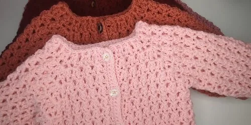 Textured shell-stitch baby cardigan for winter days